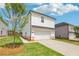 Exterior view of house showing garage, driveway, yard and siding at 1290 Firefly Field Trce, Lawrenceville, GA 30045