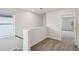Hallway with plush carpet, light filled with window and view to another room at 1290 Firefly Field Trce, Lawrenceville, GA 30045