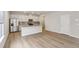 Modern kitchen features stainless steel appliances, a granite island, and white cabinetry at 1290 Firefly Field Trce, Lawrenceville, GA 30045