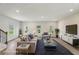 Cozy, furnished living room with a plush sofa, stylish decor, and an inviting atmosphere at 1290 Firefly Field Trce, Lawrenceville, GA 30045