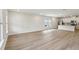 Bright and airy space shows the flooring and kitchen with white island and granite counter top at 1290 Firefly Field Trce, Lawrenceville, GA 30045