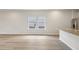 Bright and airy space shows the flooring and kitchen with white island and granite counter top at 1290 Firefly Field Trce, Lawrenceville, GA 30045