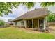 Exterior view of backyard with lawn and covered patio at 1670 Cooper Lakes Dr, Grayson, GA 30017