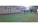Lawn with covered porch and grill, perfect for outdoor living and entertaining at 1670 Cooper Lakes Dr, Grayson, GA 30017