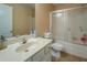 Well-lit bathroom featuring a vanity with a sink, a mirror, and a shower with sliding doors at 1670 Cooper Lakes Dr, Grayson, GA 30017