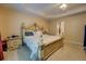 Bedroom with ornate bed frame, side tables, carpeted floors, and neutral wall color at 1670 Cooper Lakes Dr, Grayson, GA 30017