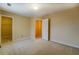 Bright bedroom with fresh paint, featuring large closet and open doorway at 1670 Cooper Lakes Dr, Grayson, GA 30017