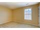 Cozy bedroom offering a window for natural light and spacious area at 1670 Cooper Lakes Dr, Grayson, GA 30017