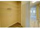 Organized walk-in closet with ample shelving for convenient storage at 1670 Cooper Lakes Dr, Grayson, GA 30017