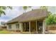 Exterior view of a house with a covered patio, perfect for outdoor relaxation and entertaining at 1670 Cooper Lakes Dr, Grayson, GA 30017