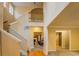 Spacious foyer with a staircase, hardwood floors, and open access to the living areas, creating a welcoming ambiance at 1670 Cooper Lakes Dr, Grayson, GA 30017