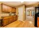 Additional kitchen cabinet space with countertop with wooden floor, next to a pass through to the living room at 1670 Cooper Lakes Dr, Grayson, GA 30017