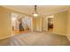 Spacious room featuring carpet, paint, trim, and access to a staircase, bathroom and what appears to be the kitchen at 1670 Cooper Lakes Dr, Grayson, GA 30017
