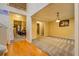 Open-concept living room with neutral carpeting, elegant lighting, and seamless flow to adjacent rooms for entertaining at 1670 Cooper Lakes Dr, Grayson, GA 30017