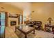 Living room featuring a cozy fireplace, hardwood floors, and comfortable seating at 1670 Cooper Lakes Dr, Grayson, GA 30017