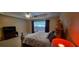 Large bedroom with tray ceilings, a ceiling fan, and large windows offering lots of natural light at 1670 Cooper Lakes Dr, Grayson, GA 30017