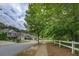 Picturesque street view showcasing well-maintained homes and lush greenery, creating a peaceful neighborhood setting at 1670 Cooper Lakes Dr, Grayson, GA 30017