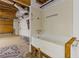 Partially finished basement with unfinished bathtub, offering potential for personalized renovations at 1750 Providence Place Dr, Alpharetta, GA 30009