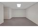 Finished basement area with neutral carpet and ample space for various activities at 1750 Providence Place Dr, Alpharetta, GA 30009