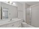 Bathroom featuring a white vanity with ample counter space, shower with glass doors, and neutral decor at 1750 Providence Place Dr, Alpharetta, GA 30009