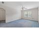 Spacious bedroom with neutral walls, ceiling fan, and a window offering natural light and views at 1750 Providence Place Dr, Alpharetta, GA 30009