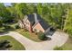 Beautiful two-story brick home with a well-manicured lawn and an extended concrete driveway at 1750 Providence Place Dr, Alpharetta, GA 30009