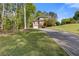 Brick home exterior with lush landscaping and driveway at 1750 Providence Place Dr, Alpharetta, GA 30009