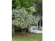 White gazebo surrounded by lush landscaping, creating a peaceful garden retreat at 1750 Providence Place Dr, Alpharetta, GA 30009
