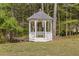 Beautiful white gazebo in a tranquil backyard setting, perfect for relaxing outdoors at 1750 Providence Place Dr, Alpharetta, GA 30009
