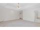 Spacious main bedroom with carpeting and ceiling fan with ample natural light at 1750 Providence Place Dr, Alpharetta, GA 30009