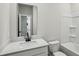 Clean bathroom features a vanity with quartz countertop and a shower-tub combination at 241 Martin Spring Rd, Lawrenceville, GA 30045