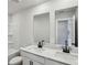 Bright bathroom boasts double sinks, a clean white color scheme, and large mirrors at 241 Martin Spring Rd, Lawrenceville, GA 30045