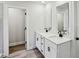 Stylish double vanity bathroom with modern fixtures and wood look floors at 241 Martin Spring Rd, Lawrenceville, GA 30045