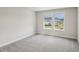 Bedroom featuring neutral carpet, a large window, and neutral paint at 241 Martin Spring Rd, Lawrenceville, GA 30045