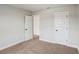 Neutral carpeted bedroom with white trim and doors, offering a clean and bright space at 241 Martin Spring Rd, Lawrenceville, GA 30045