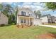 Well-maintained front yard with lush green grass, landscaping, and a view of the home's attractive exterior at 241 Martin Spring Rd, Lawrenceville, GA 30045