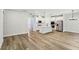 Spacious living area with a kitchen island, stainless steel appliances, and light wood floors, perfect for Gathering gatherings at 241 Martin Spring Rd, Lawrenceville, GA 30045