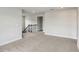 Upstairs loft area with neutral carpet and freshly painted walls, staircase access, and abundant natural light at 241 Martin Spring Rd, Lawrenceville, GA 30045