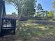 A spacious backyard featuring a shed, partial deck and ample sunlight, great for outdoor activities at 106 Evergreen Trl, Cartersville, GA 30121