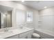 Bright bathroom with double vanity, soaking tub and large window at 1270 Firefly Field Trce, Lawrenceville, GA 30045