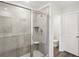 This modern bathroom features a glass-enclosed shower at 1270 Firefly Field Trce, Lawrenceville, GA 30045