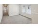 Open layout bedroom showcasing carpeted floor and natural light through multiple windows at 1270 Firefly Field Trce, Lawrenceville, GA 30045