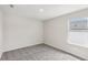 Carpeted bedroom featuring fresh white walls and natural light from the window at 1270 Firefly Field Trce, Lawrenceville, GA 30045
