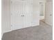 This large bedroom has a closet with double doors and neutral carpeting at 1270 Firefly Field Trce, Lawrenceville, GA 30045