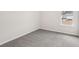 Empty carpeted bedroom featuring neutral colors and a window at 1270 Firefly Field Trce, Lawrenceville, GA 30045