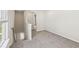 Hallway and staircase boasting carpeted floors and a naturally lit stairway at 1270 Firefly Field Trce, Lawrenceville, GA 30045