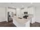 Bright kitchen featuring stainless steel appliances, shaker cabinets, and a large center island at 1270 Firefly Field Trce, Lawrenceville, GA 30045