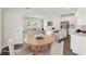 Staged open-concept kitchen and dining area with modern appliances and stylish decor at 1270 Firefly Field Trce, Lawrenceville, GA 30045