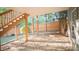 A partially covered backyard featuring a gravel area and stairs leading up to a wooden deck at 2019 Chelton Se Way, Smyrna, GA 30080