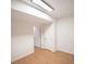 A cozy basement area featuring wood floors and neutral walls, with doorways leading to other rooms at 2019 Chelton Se Way, Smyrna, GA 30080